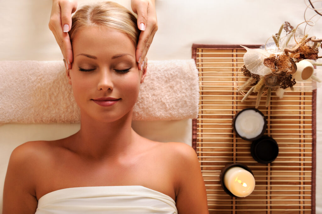 A Lady relaxing her body having a massage therapy